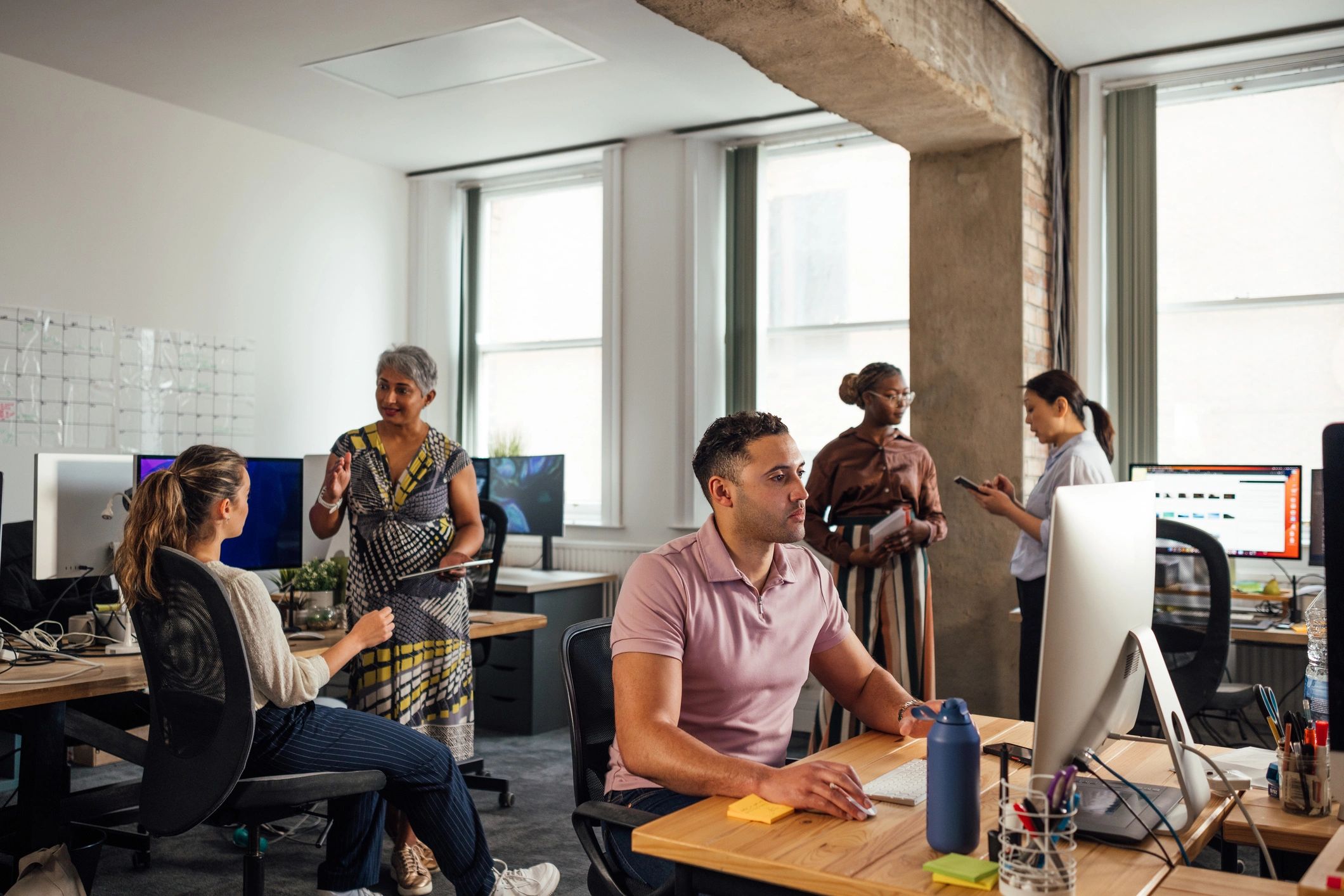 IT support team collaborating in an office