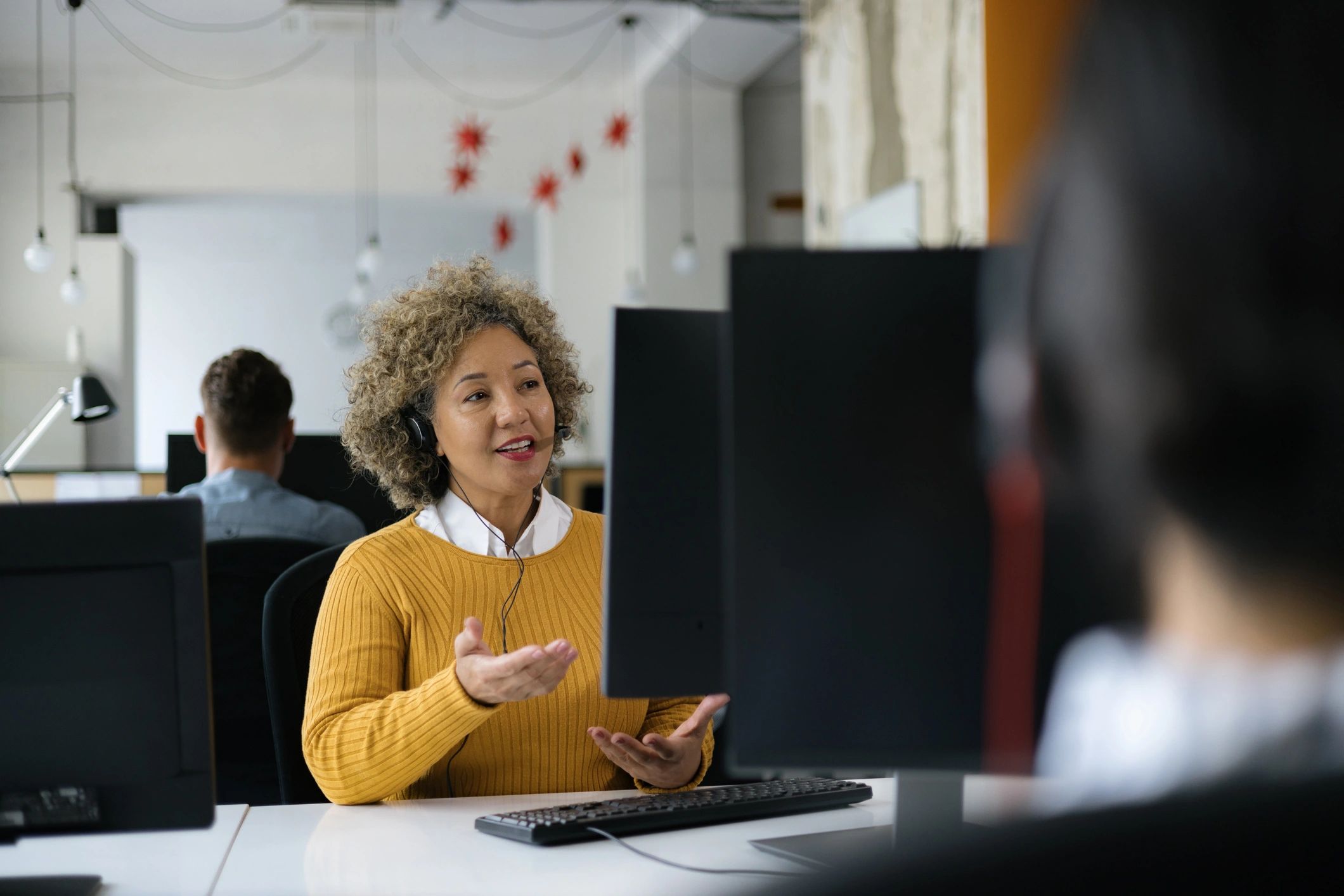 Friendly IT support professional assisting a client